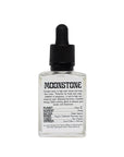Womb Cult moonstone oil bottle with dropper, featuring a clear glass container and moonstone gemstone, on a neutral background.